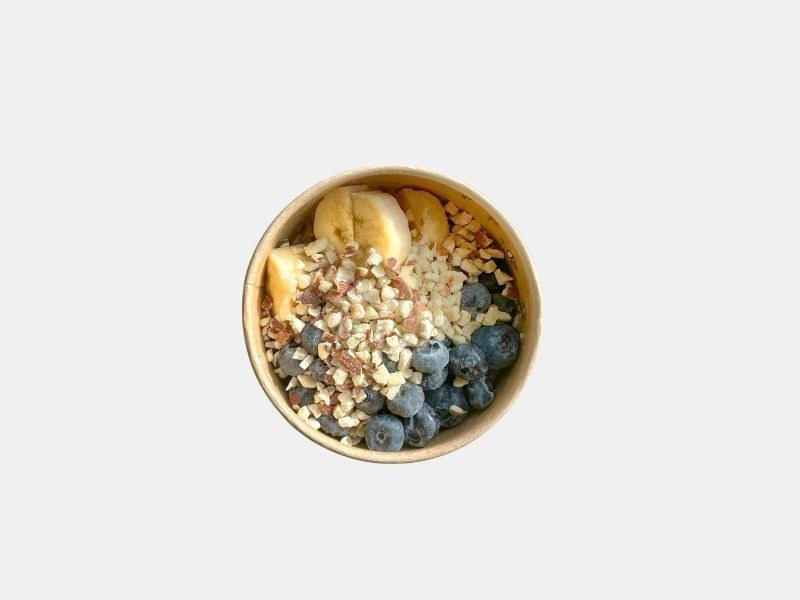 Hot oats topped with blueberries, banana, and chopped almonds